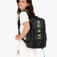 Osaka Pro Tour backpack in black with logo in green. Woman wearing the bag
