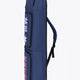 Osaka sports stickbag medium in navy with logo in white and red. Side view