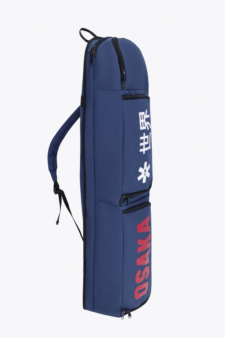 Osaka sports stickbag medium in navy with logo in white and red. Side view