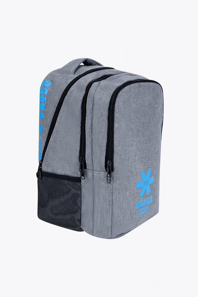 Osaka sports backpack in light grey with logo in blue. Side view