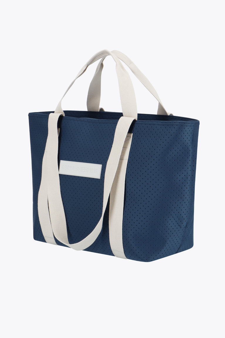 Osaka neoprene Tote bag in navy with structure and logo in white. Side view