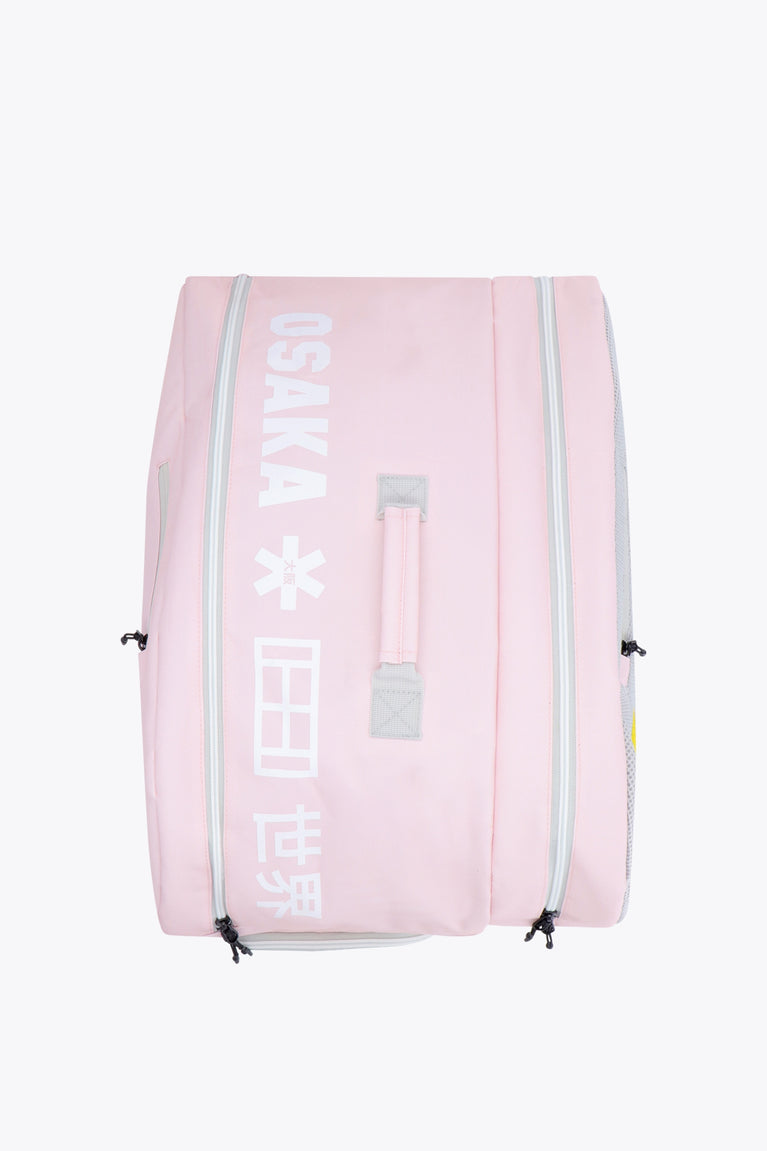 Osaka sports padel bag medium in pastel pink with logo in white. Side view