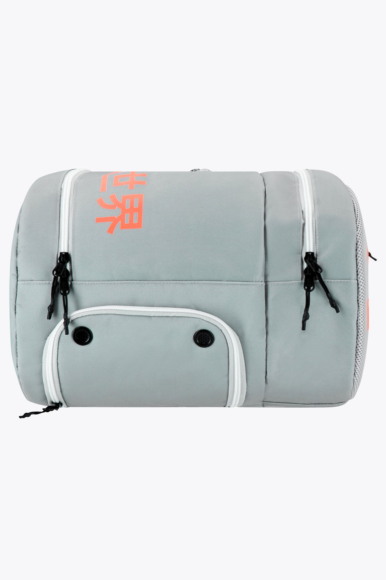 Osaka sports padel bag medium in grey with logo in orange. Side view