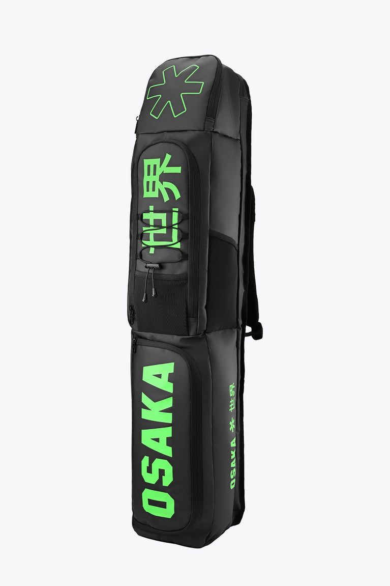 Medium stickbag black with green Osaka branding and backpack straps on back side