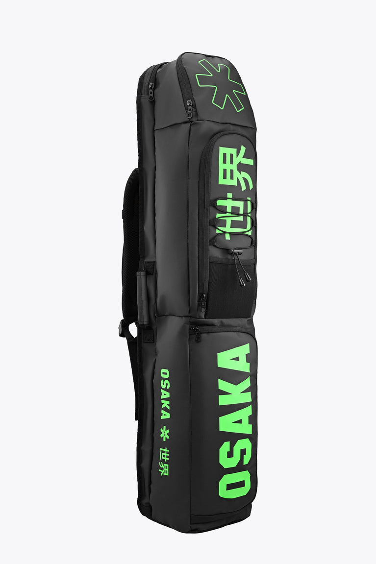 Medium stickbag in black with backpack straps and green Osaka logo lettering