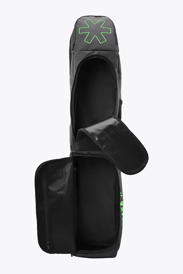 Medium stickbag in black with open front flap, interior panels, and green Osaka logo