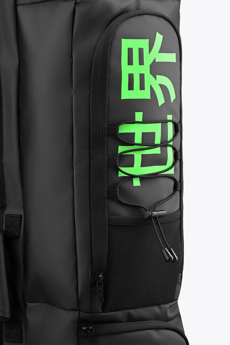 Medium stickbag black with front zipper pocket and lanyard pull; green Osaka logo