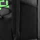 Medium stickbag black with textured panels and zipper seams; green graphic detail