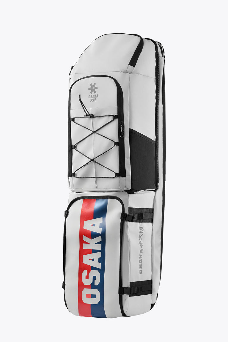 Modular stickbag, side view: white body with black accents and Osaka red/blue stripe.