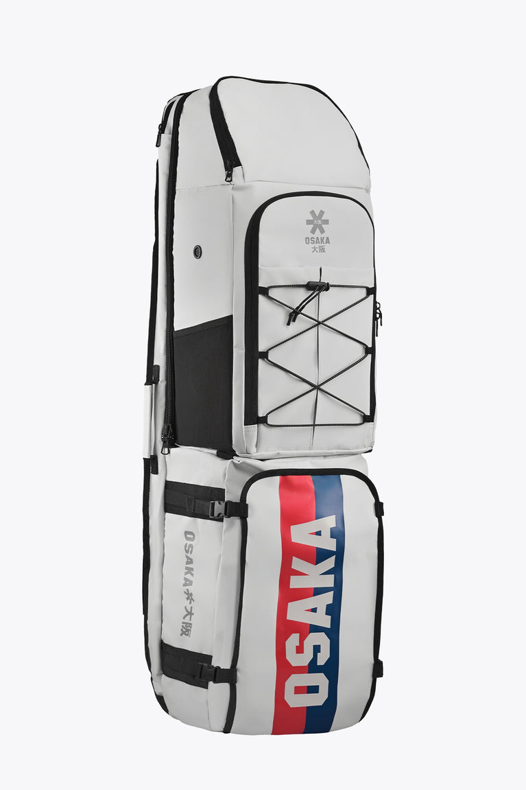 Modular stickbag, angled view: light gray-white with Osaka red/blue vertical stripe.