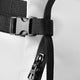 Stickbag close-up of straps and metal buckle hardware on black webbing.