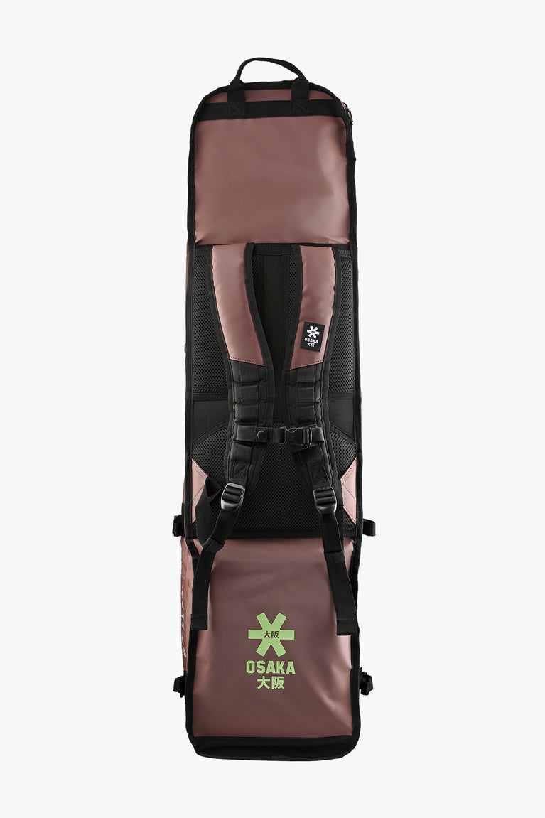 Large Osaka stick bag back view with black straps, webbing, and Osaka emblem.