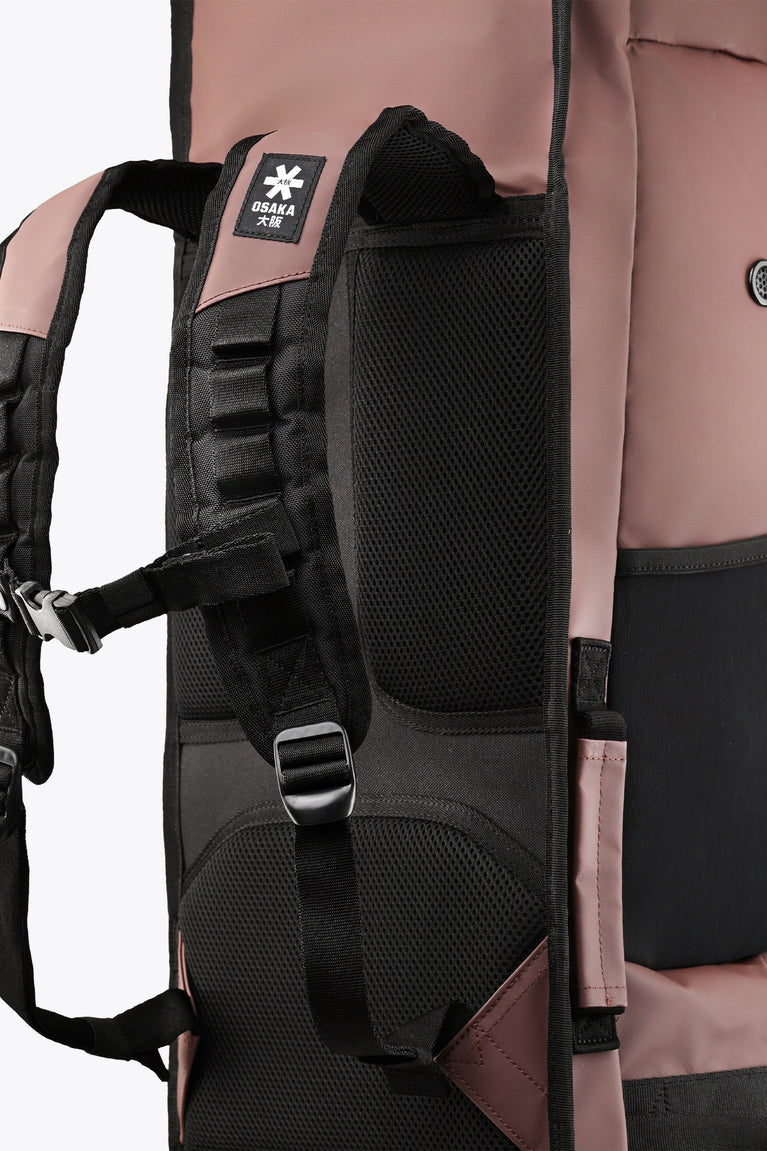 Large Osaka stick bag close-up of black padded shoulder strap and mesh back panel.