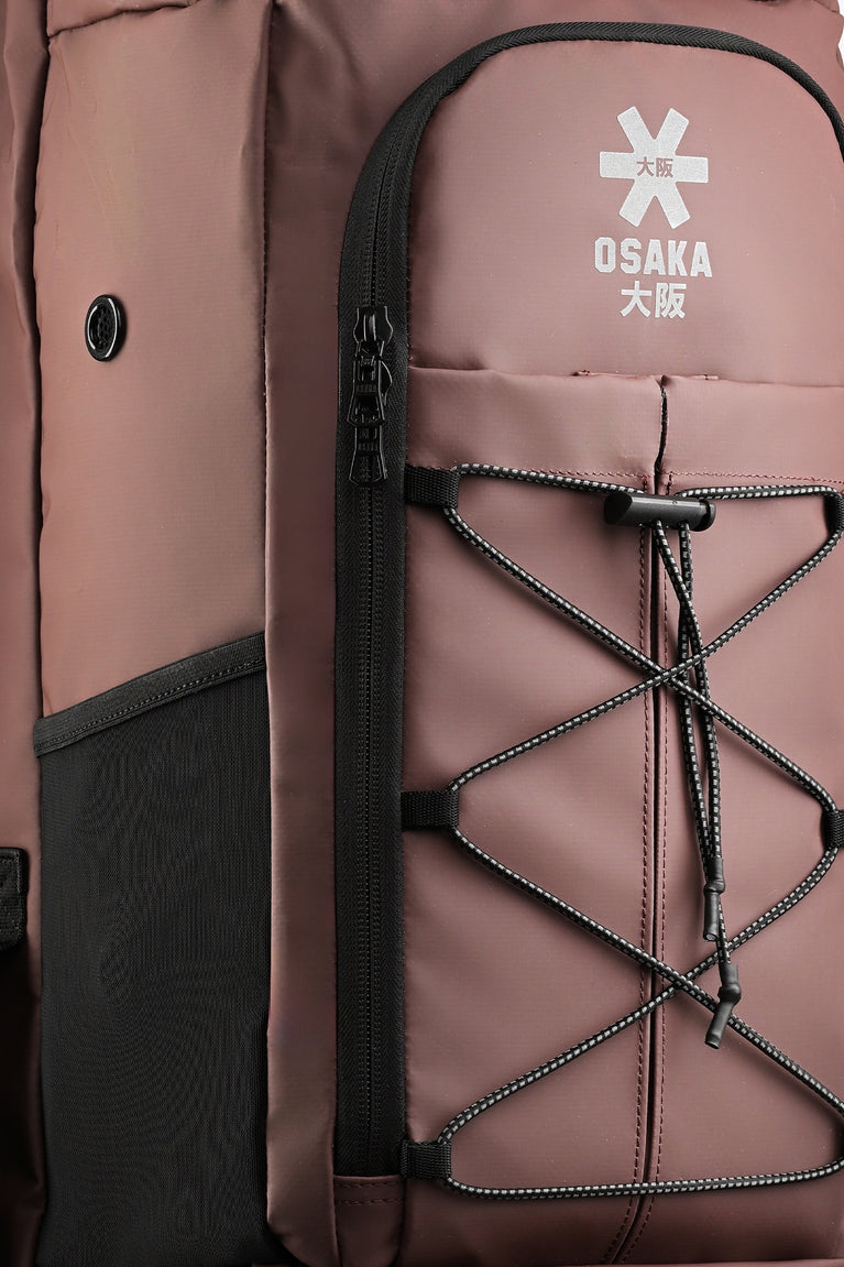 Large Osaka stick bag close-up of peppercorn front pocket with laced interior and Osaka text.
