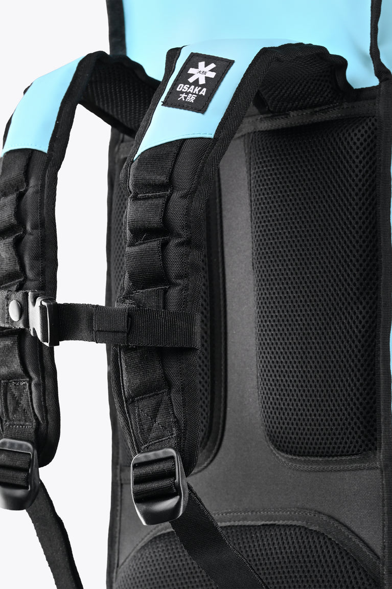 Large Osaka stickbag with black padded straps and mesh pocket, blue top