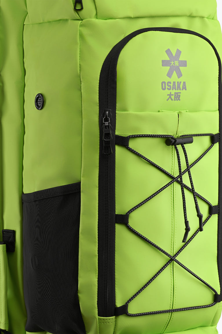 Wild lime Osaka stickbag close-up of black zipper pocket and white star logo panel