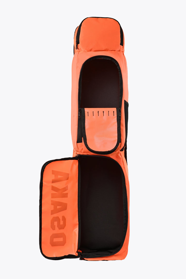 Orange medium stickbag open at front, showing interior compartment and black lining.