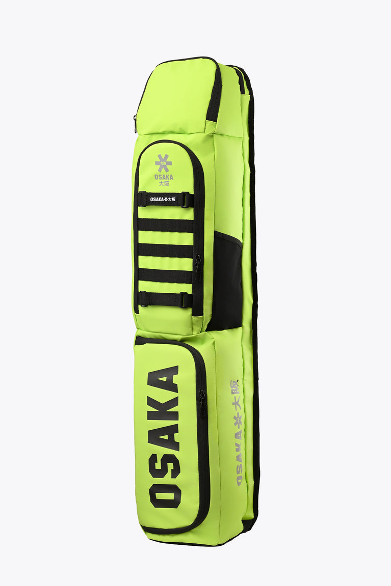 Lime green stickbag with black Osaka branding and padded sleeve detail