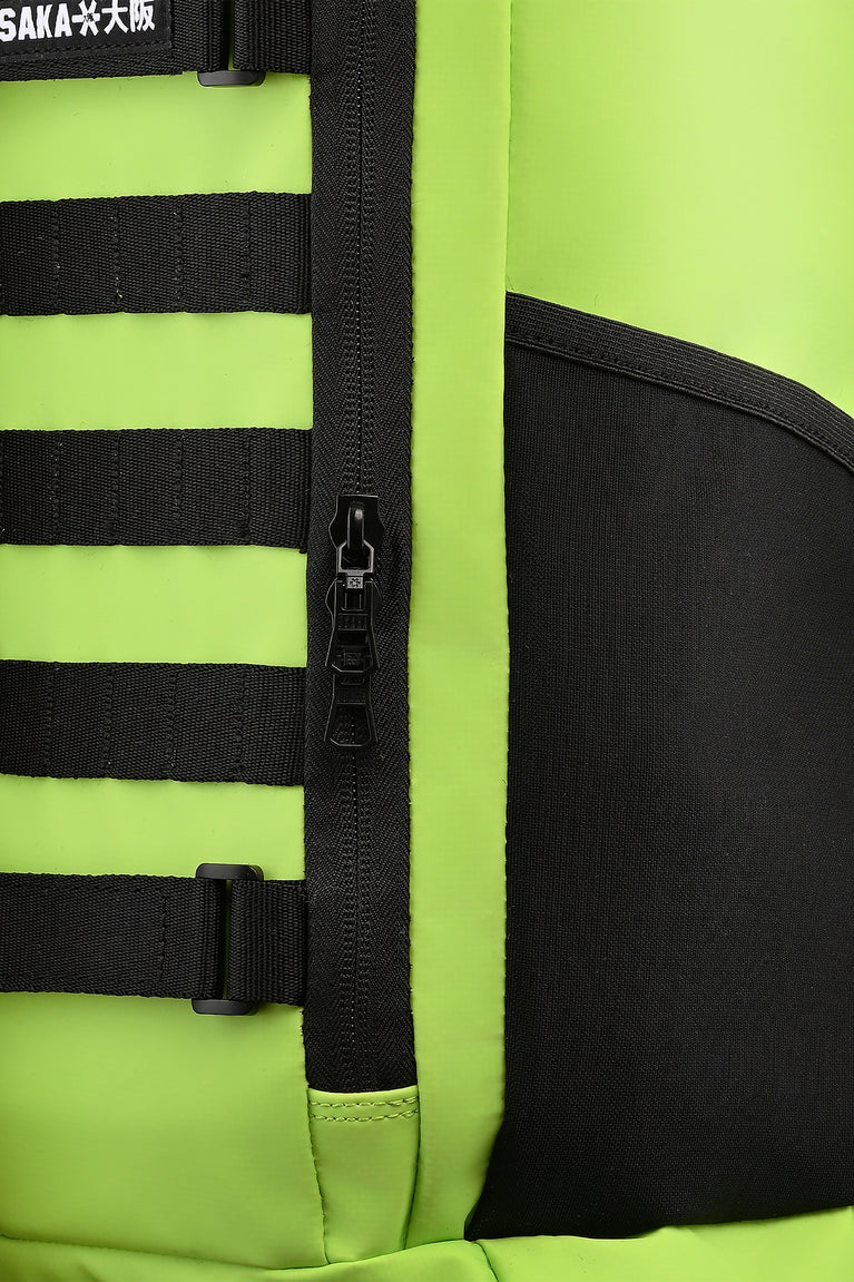 Stickbag close-up: black zipper track and wide black stripe straps on lime fabric