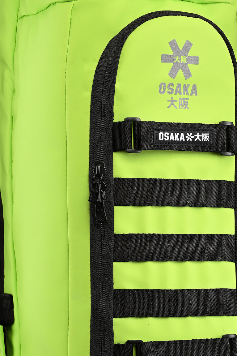 Stickbag close-up of Osaka logo patch and black strap across lime panel
