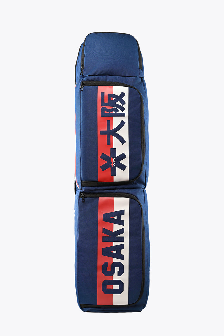 Blue large stick bag with vertical red graphic patch and Osaka text, zip front