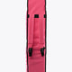 Hot pink padded stickbag with black top and front closure straps