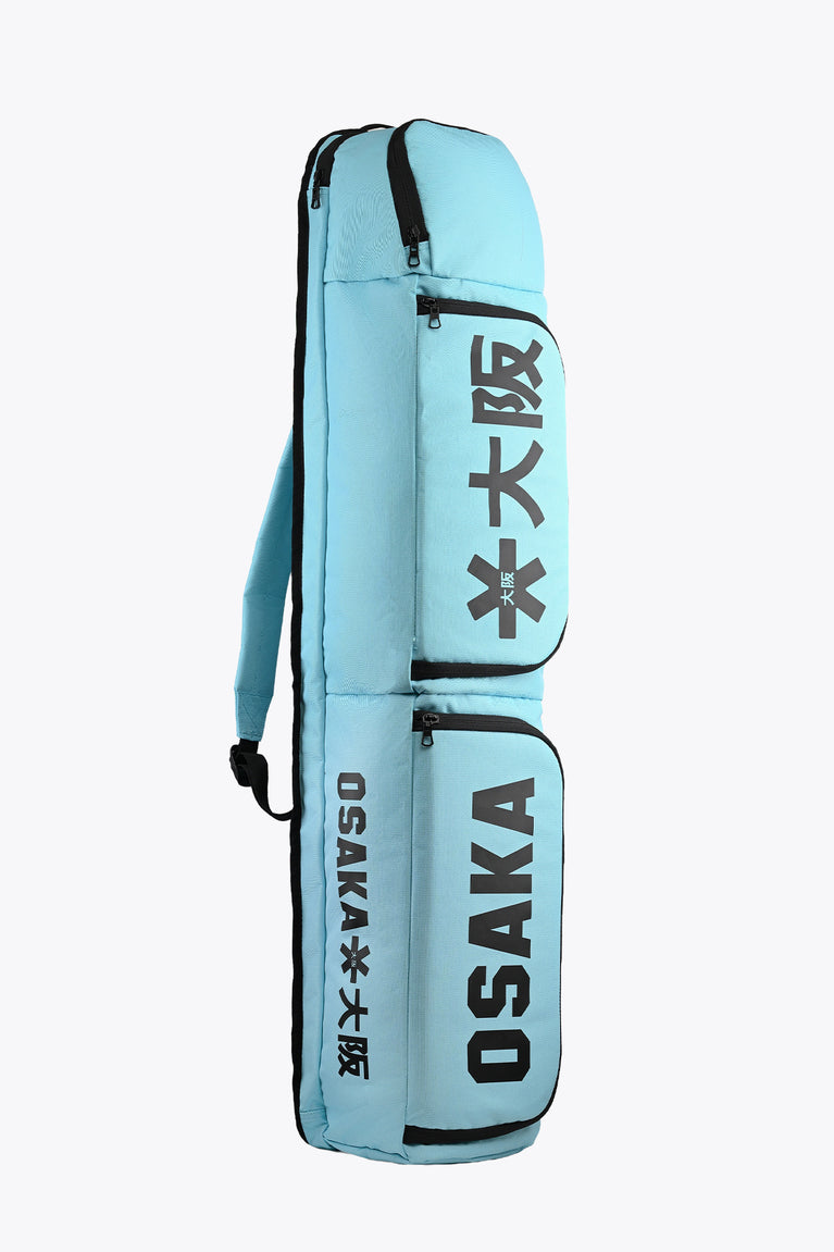 Medium sports stickbag, Blue Topaz, with Osaka logo, zip compartments and straps
