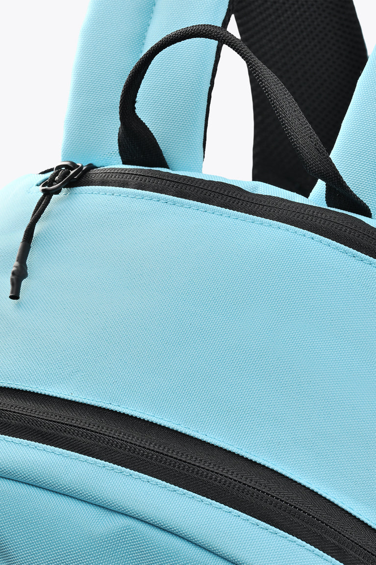 Light blue backpack top zipper track with black zipper and pull tabs