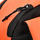 Kids sports backpack close-up: black zipper pull and mesh side panel on orange