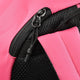 Hot pink backpack zipper and black mesh strap close-up