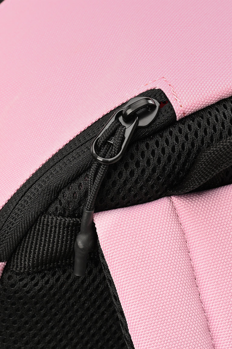 Close-up of pastel pink backpack zipper with black mesh trim
