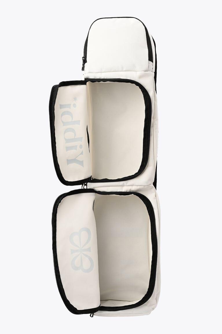 Small sports stickbag with two padded compartments; white exterior with black piping