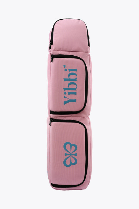 Small pastel pink sports stickbag with two zip front pockets, black trim