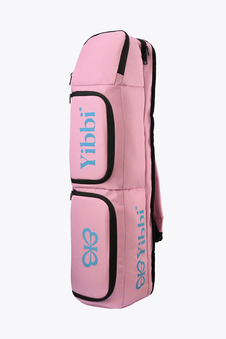Pastel pink small sports stickbag with two front compartments and black zipper edges