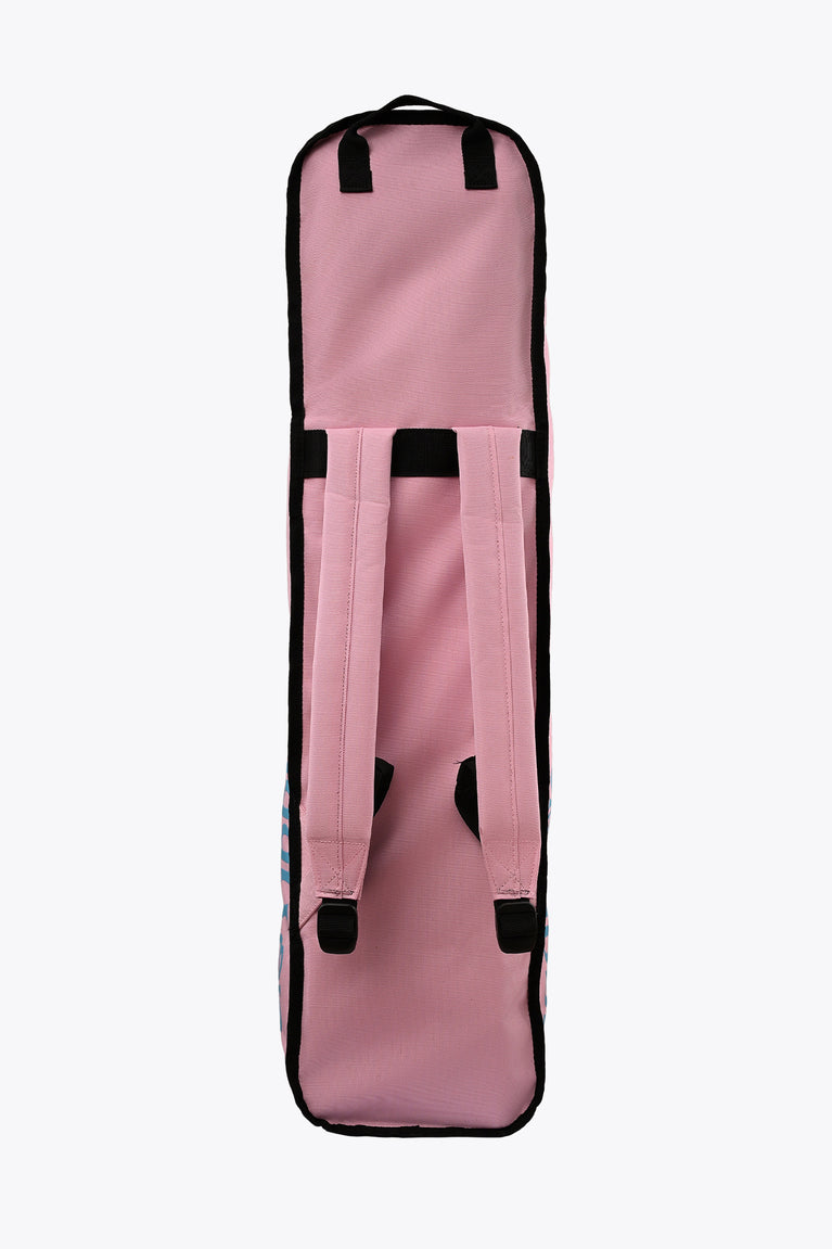 Small pastel pink sports stickbag with padded shoulder straps and black top accents