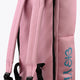 Pastel pink sports stickbag close-up of padded shoulder straps and black trim