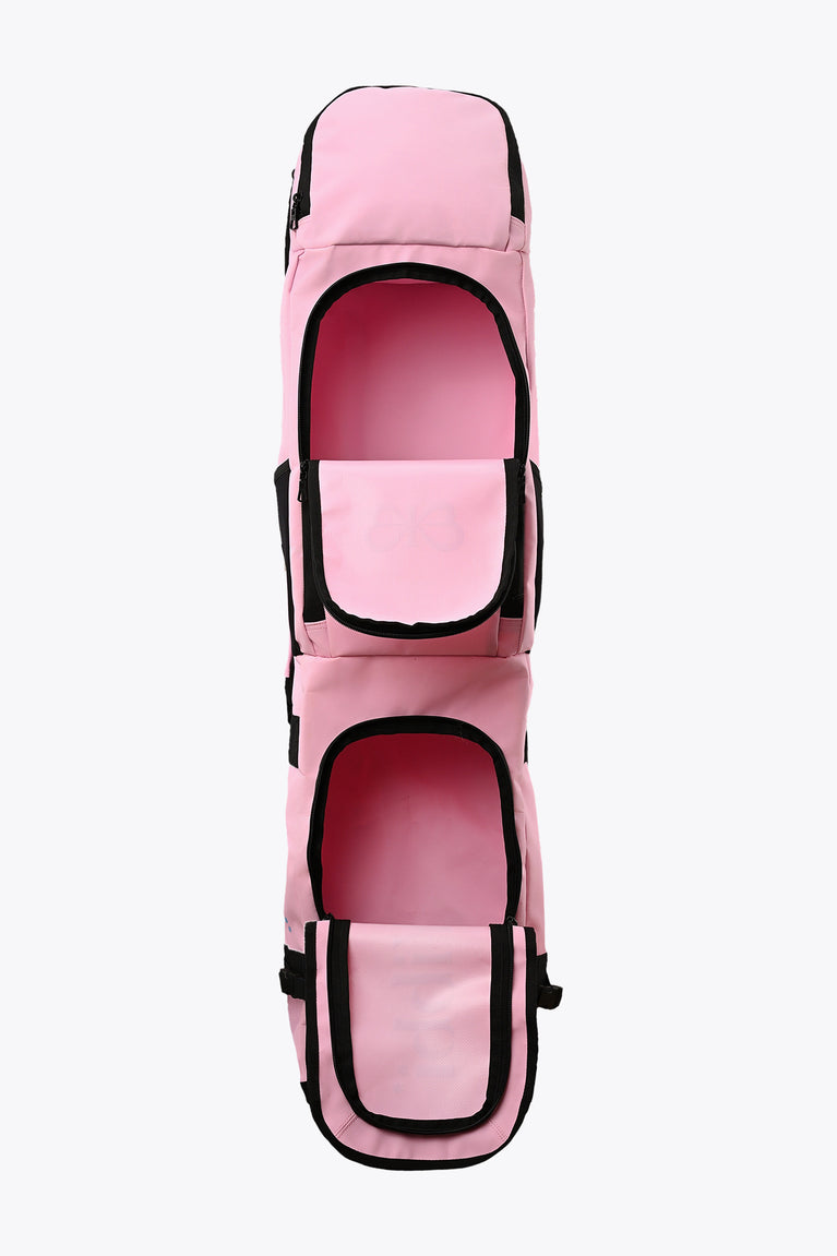 Pastel pink hockey stick bag with two oval openings and black support straps