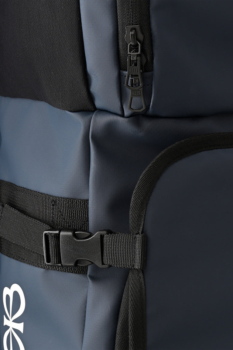 Hockey stick bag close-up: dark navy padded straps with plastic buckles