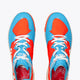 Osaka footwear Ido Mk1 in orange and blue with logo in white. From above view
