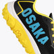 Osaka footwear Kai Mk1 in black and yellow with logo in blue. Detail logo view