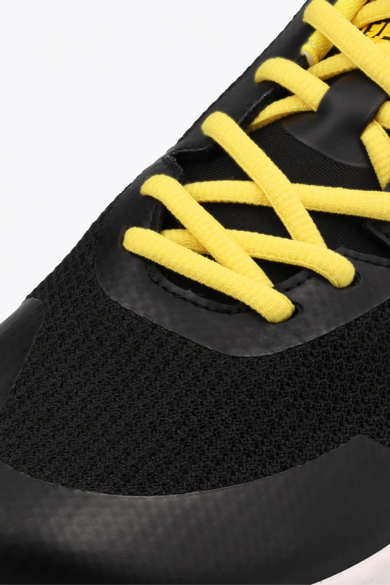 Osaka footwear Kai Mk1 in black and yellow with logo in blue. Detail shoelace view