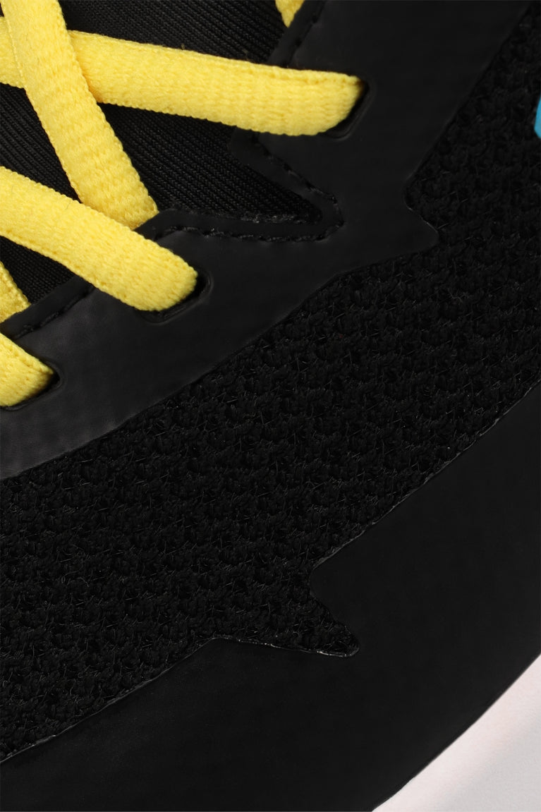 Osaka footwear Kai Mk1 in black and yellow with logo in blue. Detail view