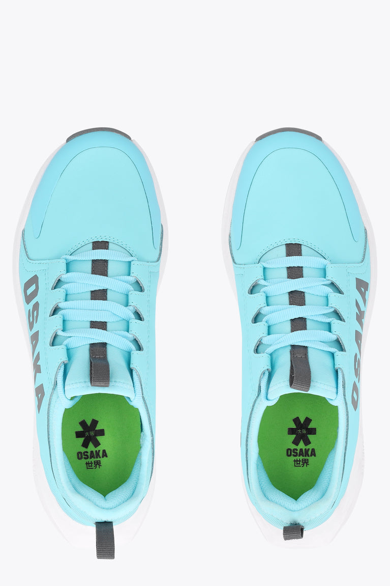 Kids light-blue sneakers with lace-up front and green-lined tongue, OSKA detail