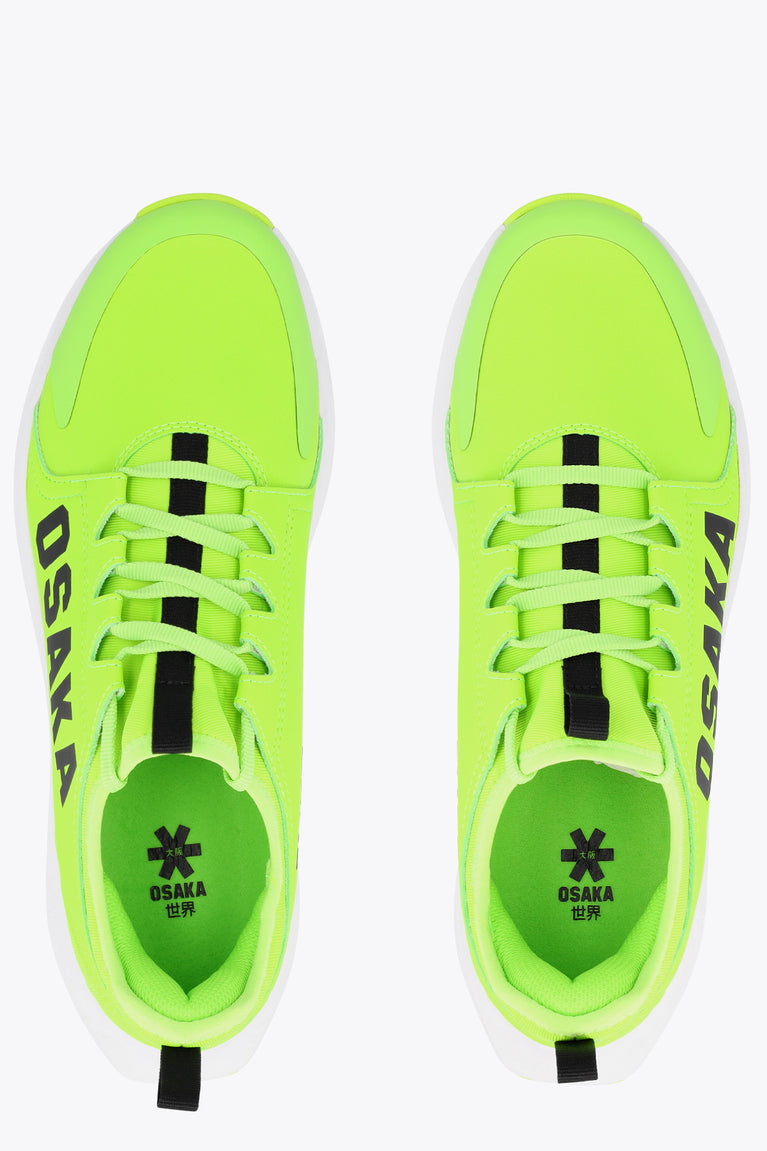 Neon lime sneakers with black laces and 'OSAKA' detail on insole