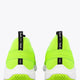 Lime green lace-up sneaker with black heel pull tab reading 