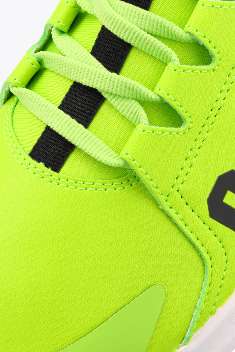 Lime green sneaker upper with black lace stripe inserts and stitched side panel