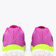 Rose bud pink sneakers showing heels, neon green midsole, and white tread outsole