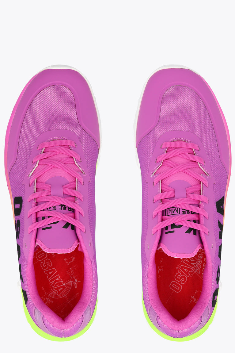 Rose bud pink low-top sneakers with neon green sole and pink lace-up front