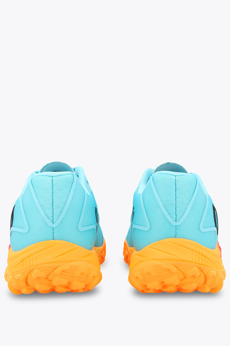 Light blue sneakers with heel tab and orange rubber outsole