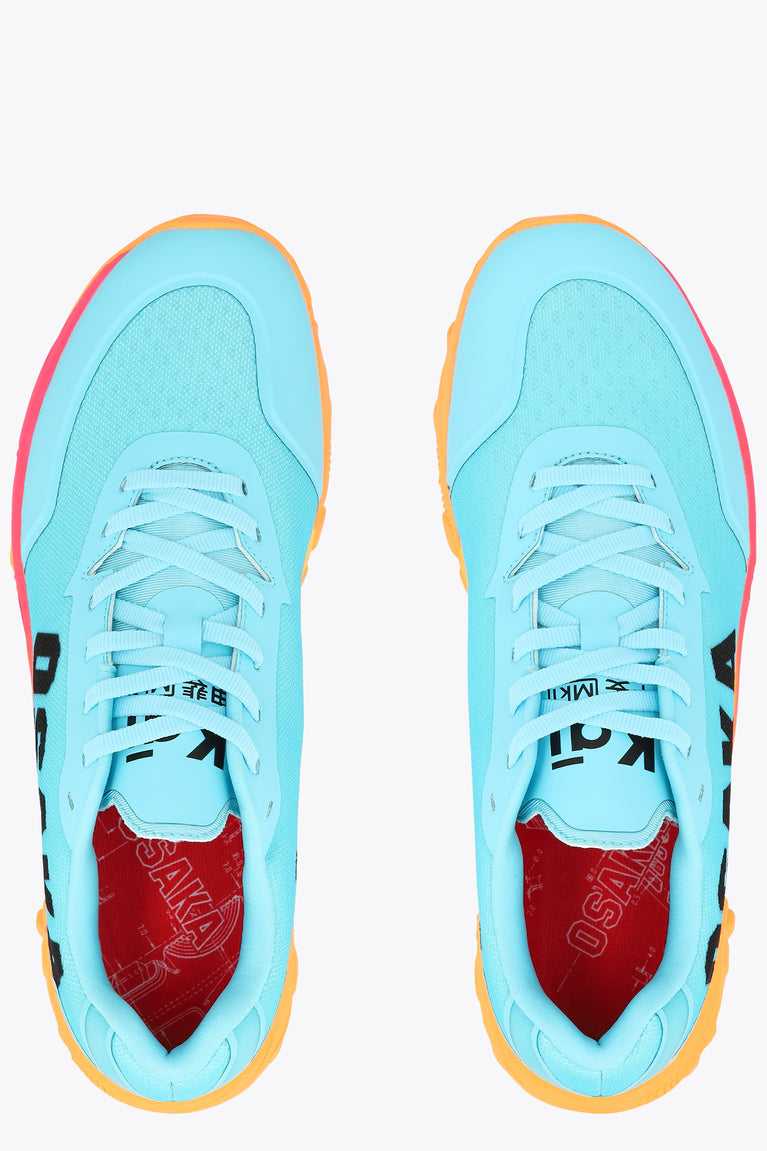 Pair of light blue sneakers with red inner lining and orange trim